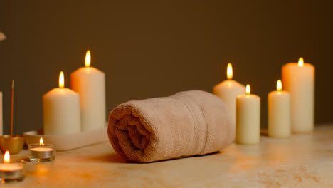 Still-Life-Of-Lit-Candles-With-Dried-Grasses-Incense-Stick-And-Soft-Towels-As-Part-Of-Relaxing-Spa-Day-Decor-6